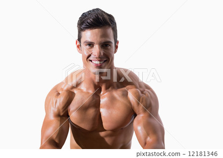 Portrait of a smiling shirtless muscular man Portrait of a smiling shirtless muscular man 12181346