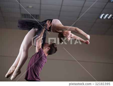Ballet partners dancing gracefully together Ballet partners dancing gracefully together 12181395
