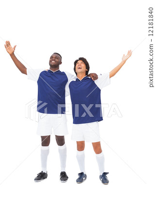 Football players in blue celebrating 12181840