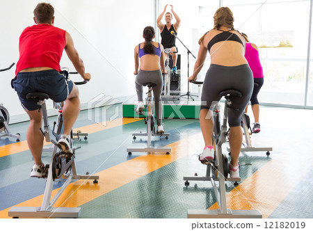 Spin class working out with motivational instructor 12182019
