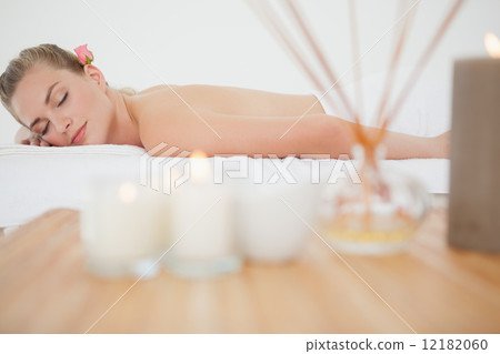 Beautiful blonde relaxing on massage table 12182060