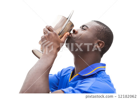 Football player in blue kiss winners cup Football player in blue kiss winners cup 12182062