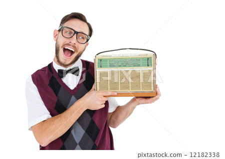 Geeky hipster holding a retro radio 12182338