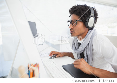 Hipster businessman working at his desk 12182433