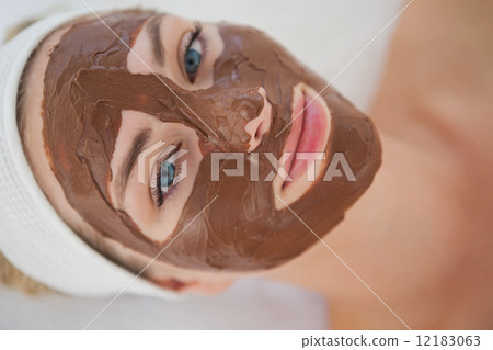 Beautiful blonde getting a chocolate facial treatment 12183063