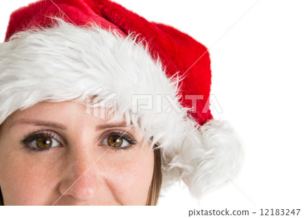 Close up portrait of pretty woman in santa hat smiling 12183247
