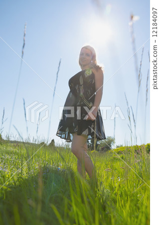 Pretty blonde in sundress smiling at camera 12184097