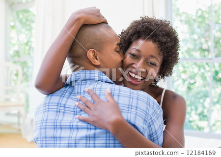 Happy couple cuddling on their bed Happy couple cuddling on their bed 12184169