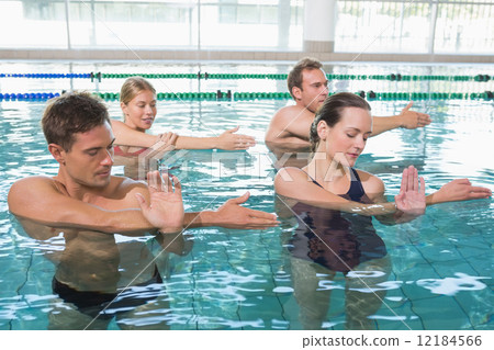 Happy fitness class doing aqua aerobics 12184566