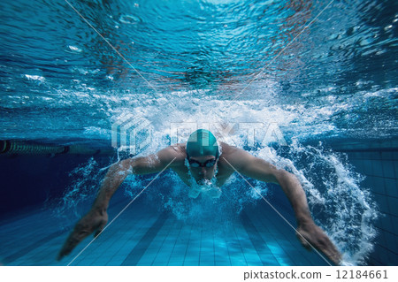 Fit swimmer training by himself Fit swimmer training by himself 12184661