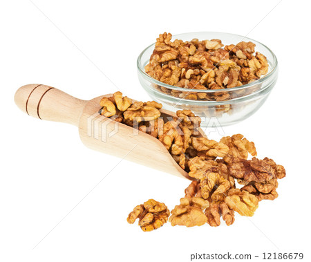 Handful of walnuts in scoop and glass bowl isolated on white. Handful of walnuts in scoop and glass bowl isolated on white. 12186679