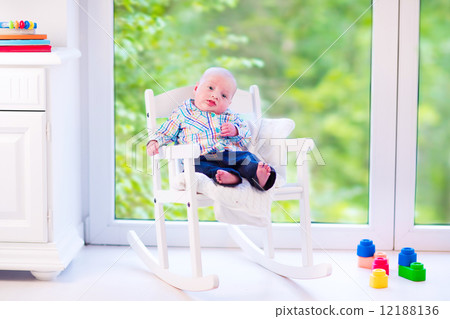 Baby boy n a rocking chair Baby boy n a rocking chair 12188136