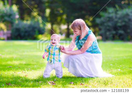 Woman and baby in a park Woman and baby in a park 12188139