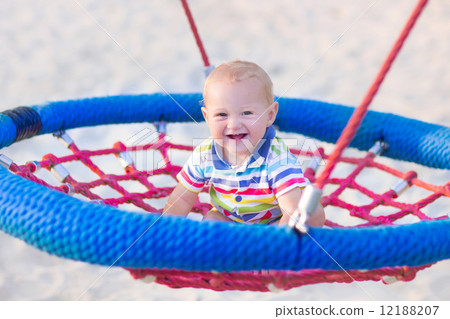 Baby boy on a swing Baby boy on a swing 12188207