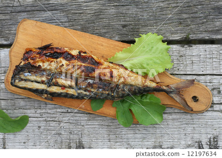 Grilled mackerels on the grill on campfire 12197634