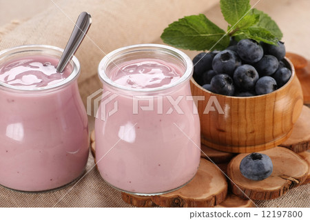 yogurt with blueberries in a glass jar and blueberries in a glas yogurt with blueberries in a glass jar and blueberries in a glas 12197800