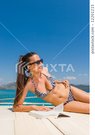 Young woman on her private yacht Young woman on her private yacht 12201215