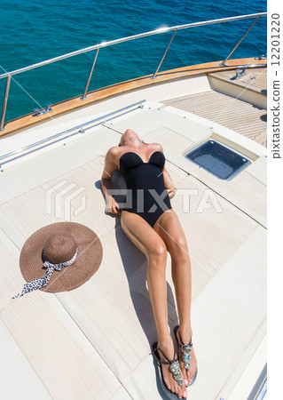 Young woman on her private yacht 12201220