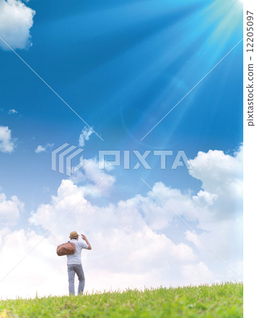 A traveler walking on a hill 12205097