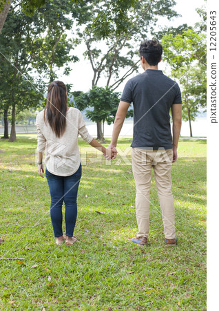 Young couple in a park. Young couple in a park. 12205643