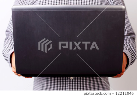 Closeup image of a man holding laptop 12211046