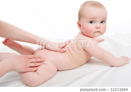 Mother massaging her lovely baby 12211664