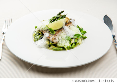 Sea bass fillet with asparagus infused with sauce foam Sea bass fillet with asparagus infused with sauce foam 12215319