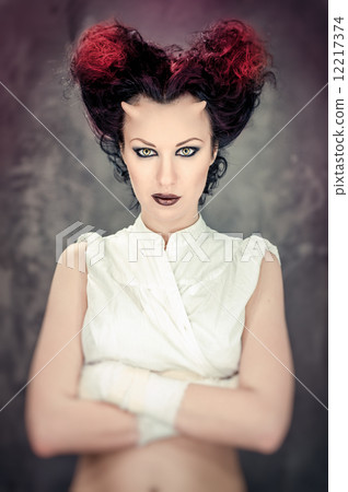 Portrait of beautiful horned woman with bright makeup 12217374