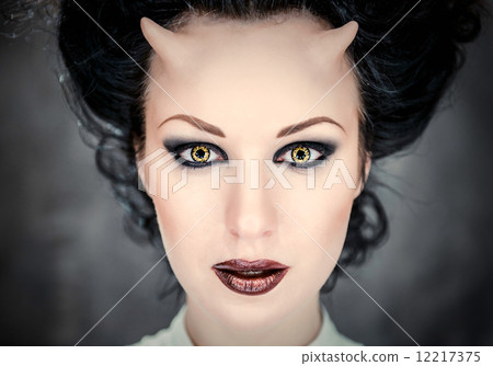 Portrait of beautiful horned woman with bright makeup 12217375