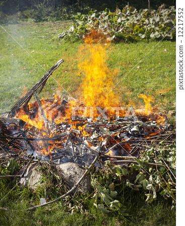 Garbage in fire, garden illegal burn refuse. Garbage in fire, garden illegal burn refuse. 12217552