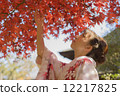 Autumnal leaves and kimono women 12217825