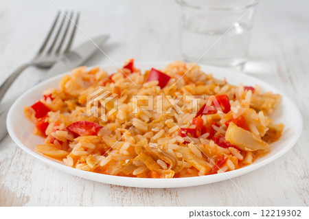 rice with codfish and vegetables on the plate 12219302