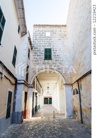 Ciutadella old town narrow street with archway, Menorca, Spain. 12219423