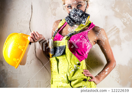 Female construction worker in respirator Female construction worker in respirator 12222639