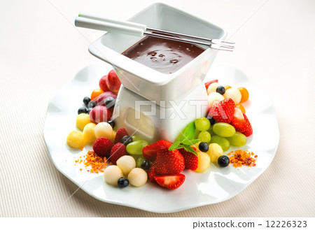 Chocolate fondue with fresh fruits and berries Chocolate fondue with fresh fruits and berries 12226323