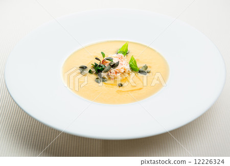 Pumpkin crab soup on a white bowl Pumpkin crab soup on a white bowl 12226324