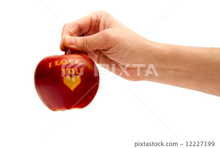ripe red apple with the words "I love you" holding in hand ripe red apple with the words "I love you" holding in hand 12227199