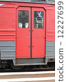 Red doors of a carriage of an electric train at the platform 12227699