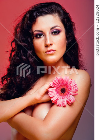 Attractive young woman with flower Attractive young woman with flower 12228024
