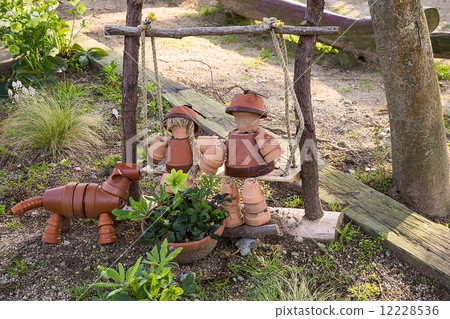Spring gardening · terra cotta doll and pet 12228536