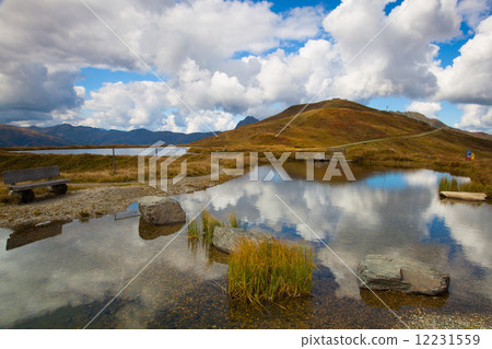 Mountain road in autumn landscape in Tirol Alps 12231559