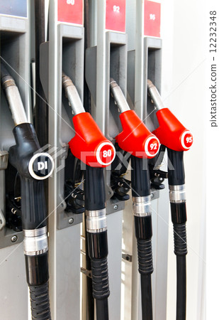 Refueling pistols on a gasoline station 12232348