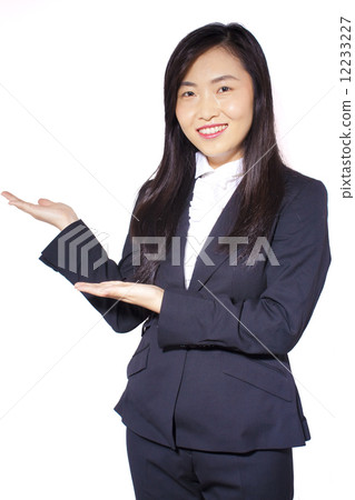 Asian female businesswoman showing hands presenting Asian female businesswoman showing hands presenting 12233227