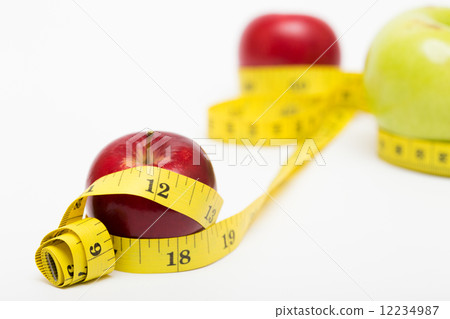 red apple and measuring tape 12234987