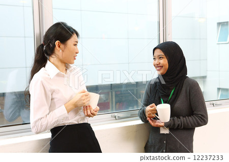 Two Asian business women who are taking a break 12237233