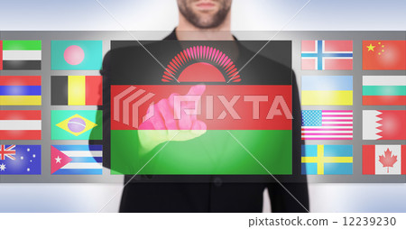 Hand pushing on a touch screen interface Hand pushing on a touch screen interface 12239230