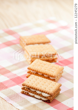 Sandwich cookies on pink tablecloth Sandwich cookies on pink tablecloth 12245279