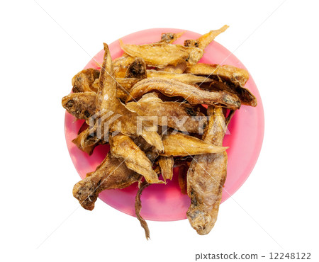 top view of mini fried sole fish on pink plastic plate isolated top view of mini fried sole fish on pink plastic plate isolated 12248122
