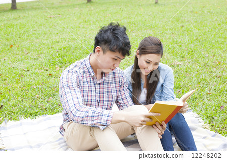 Young couple enjoying in the park. Young couple enjoying in the park. 12248202