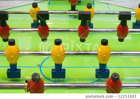 Table football game with yellow and red players Table football game with yellow and red players 12251891